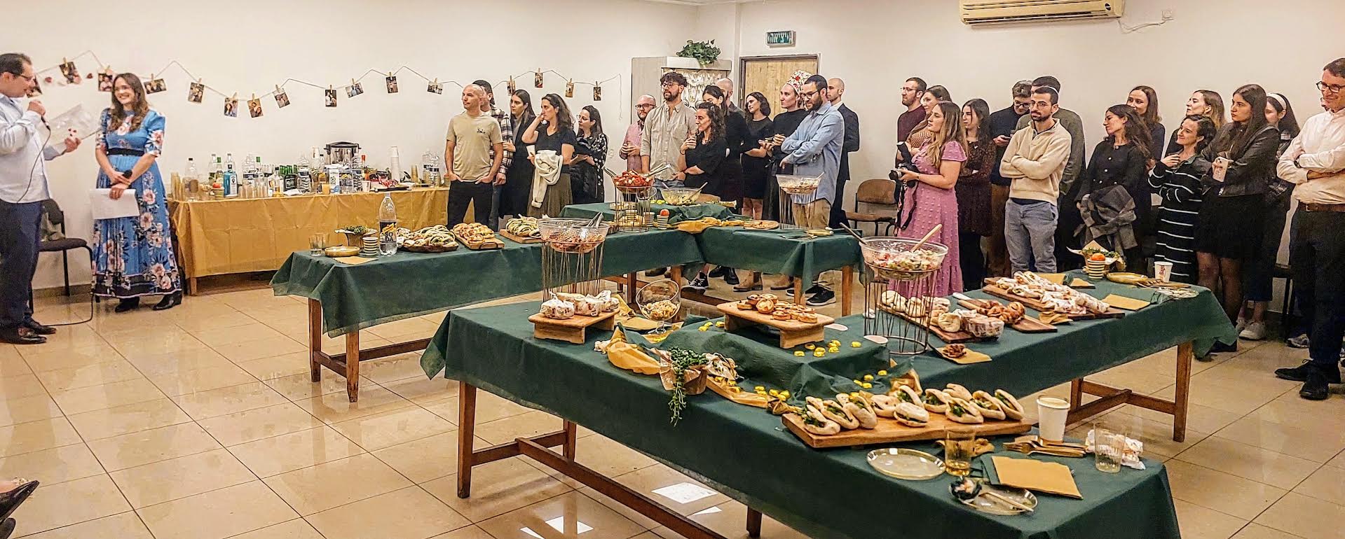 Family and friends enjoying an engagement party with a generous buffet