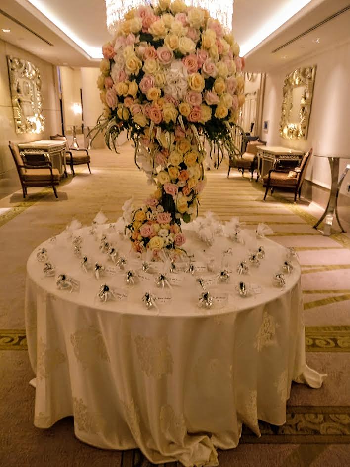A dramatic floral welcome table