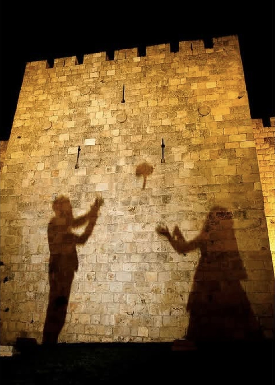 Wedding silhouettes against Jerusalem’s illuminated walls