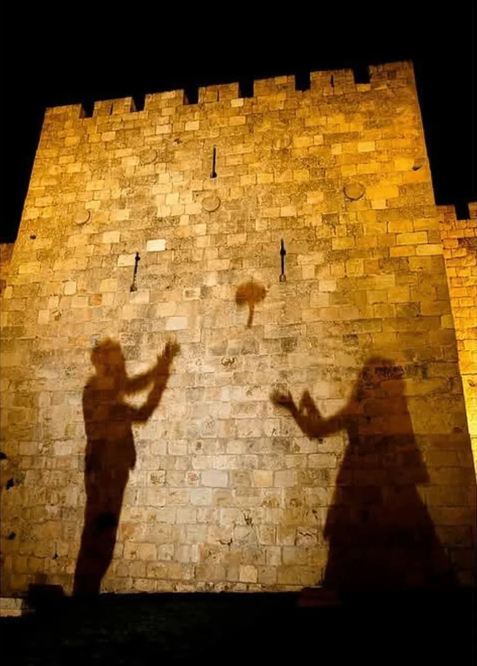 Wedding silhouettes against Jerusalem’s illuminated walls